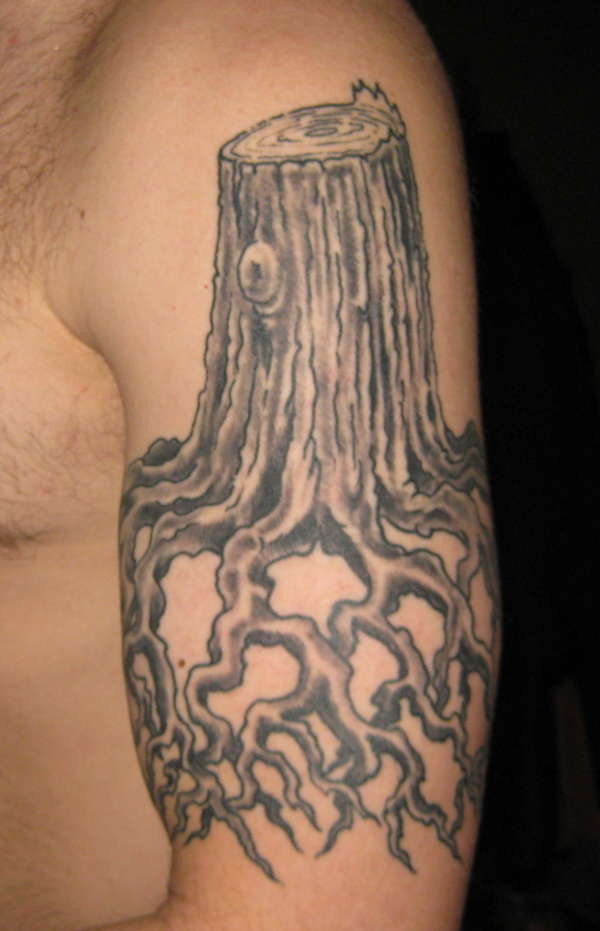 Stump and roots tattoo