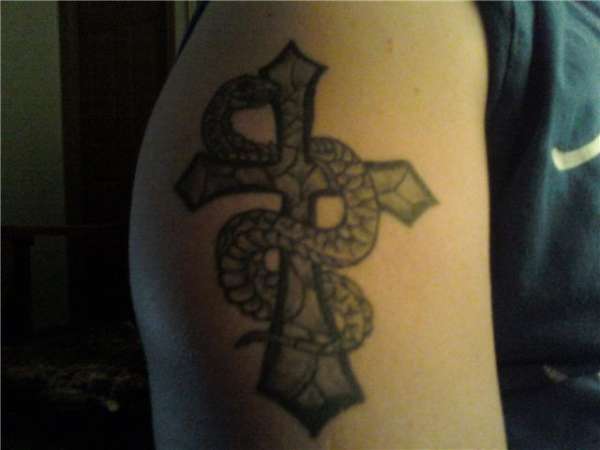 cross with serpent wrapped around it tattoo
