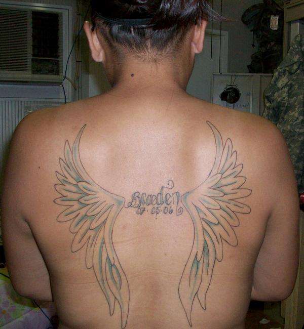 Wings w/sons name tattoo