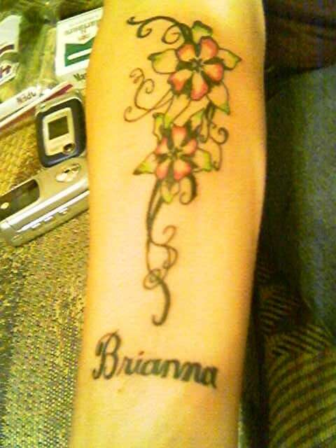 flowers on forearm tattoo