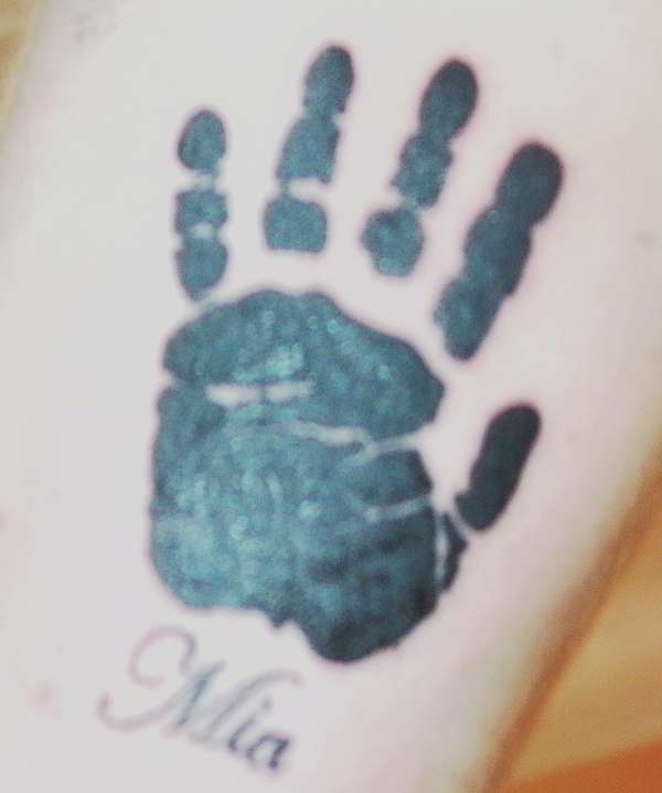 mia's hand tattoo