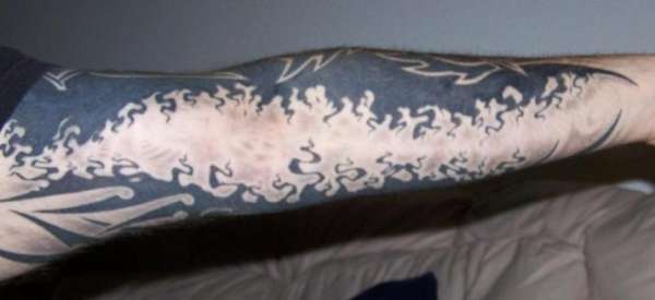 Original Tripped out tribal arm sleeve tattoo