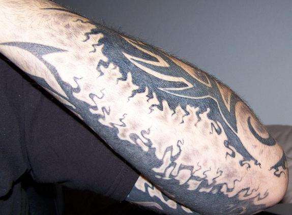Original Tripped out tribal arm sleeve tattoo