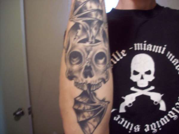 skull and wings tattoo