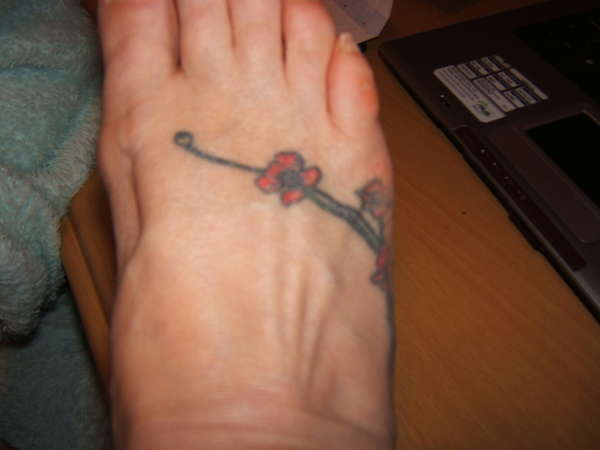 Poppies on foot tattoo
