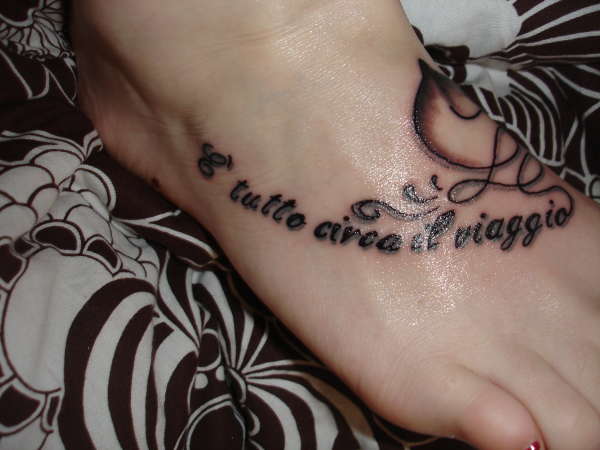 Italian phrase and profile of a horsehead tattoo