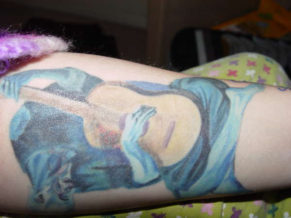 The old guitar player tattoo