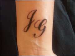 left wrist. son & boyfriends initials tattoo