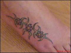 tribal mix, left foot tattoo