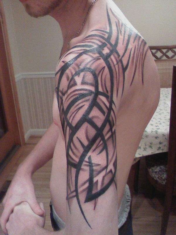 Left arm tribal tattoo