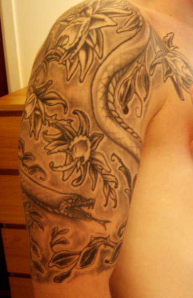 Orchids and snakes finished tattoo