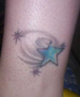 star with black swirlies. tattoo