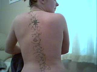 stars down back tattoo