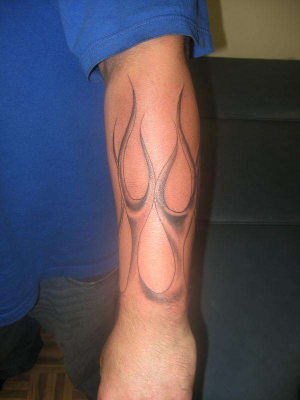 gray and black flames tattoo