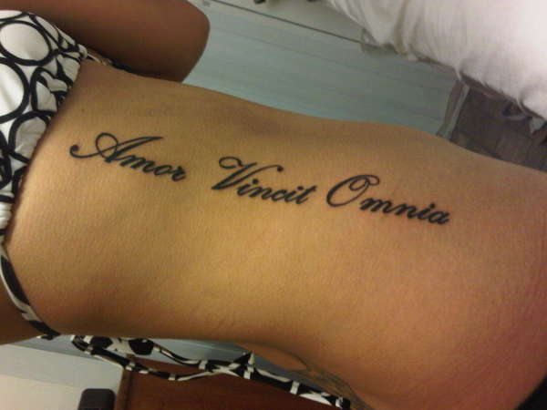 love conquers all tattoo