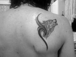 Wolf + tribal shoulderblade tattoo tattoo
