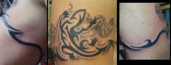 geko tribal with two letters sons names tattoo