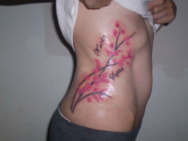 cherry blossom with daughters names tattoo