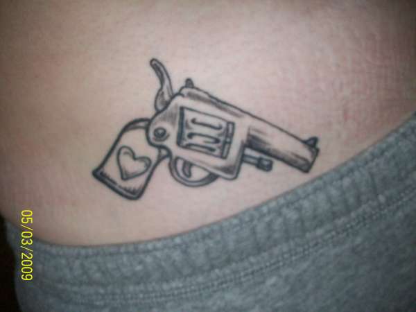 Gun w/ heart tattoo