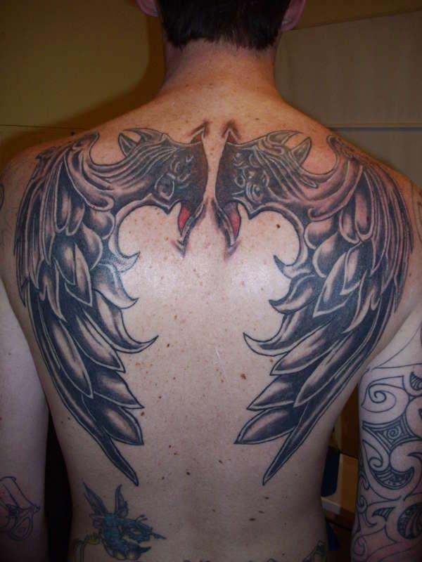 tribal devil wing tattoo
