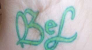 Son's initials tattoo