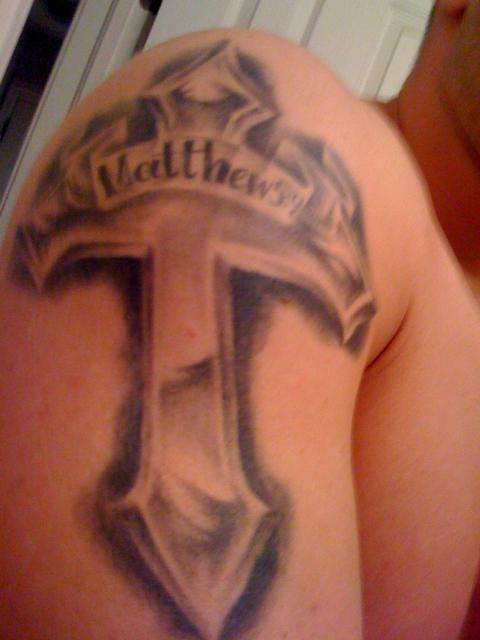 Cross (metal) tattoo