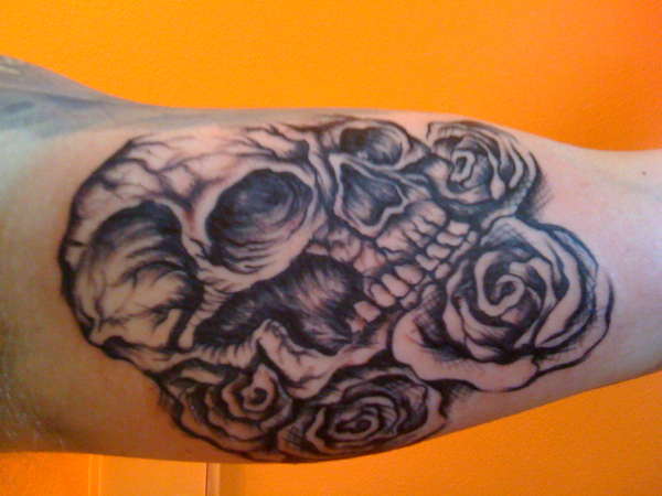 skull in roses tattoo