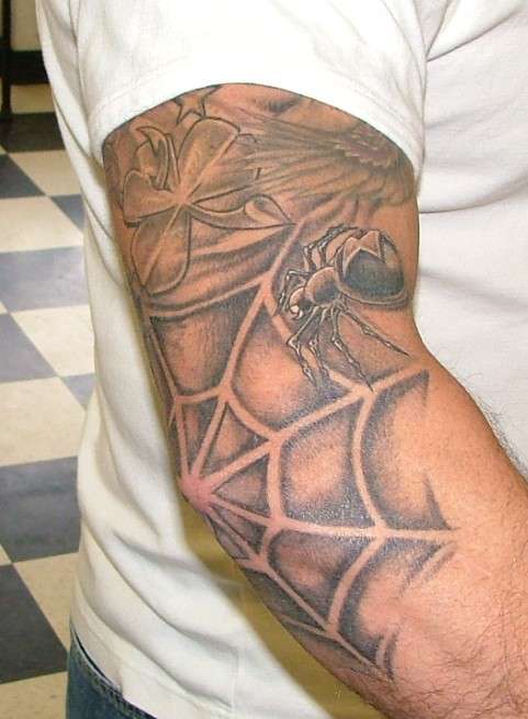 negative spider web tattoo