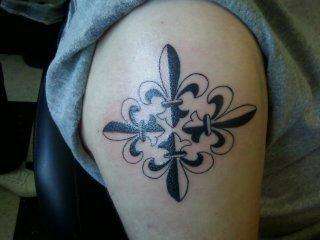 fluer de lis cross tattoo
