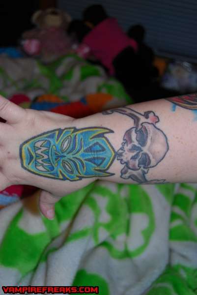 mask and skull wrist tats tattoo