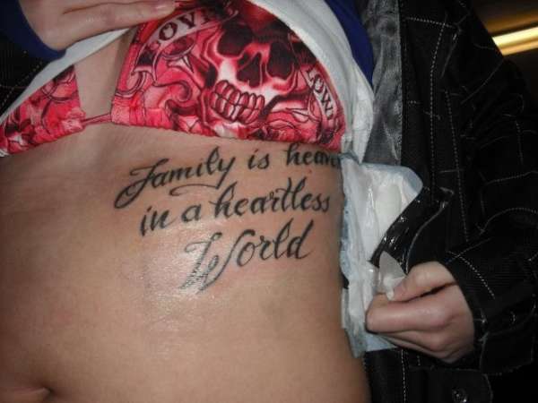 Family is heaven in a heartless world. tattoo