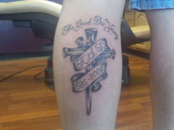 Cross in memory of my cousin tattoo
