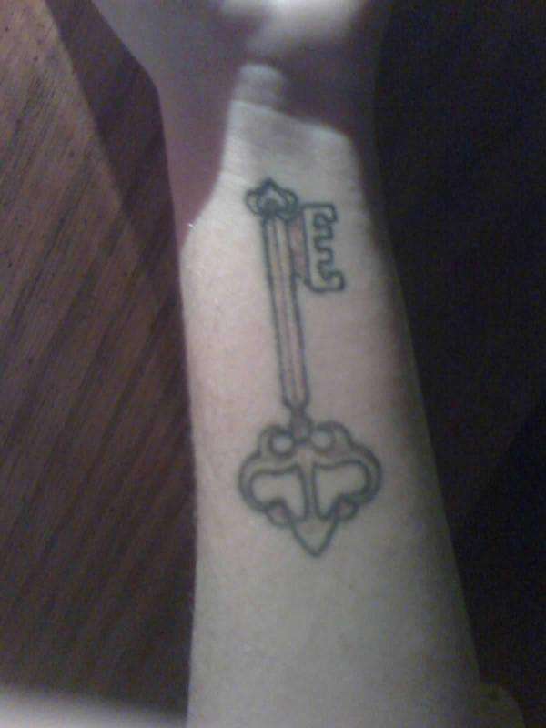Key-left wrist tattoo