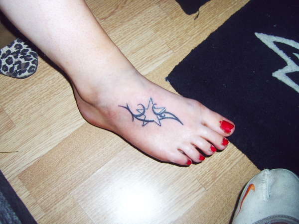 Star and tribal tattoo