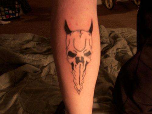 skull with horns tattoo