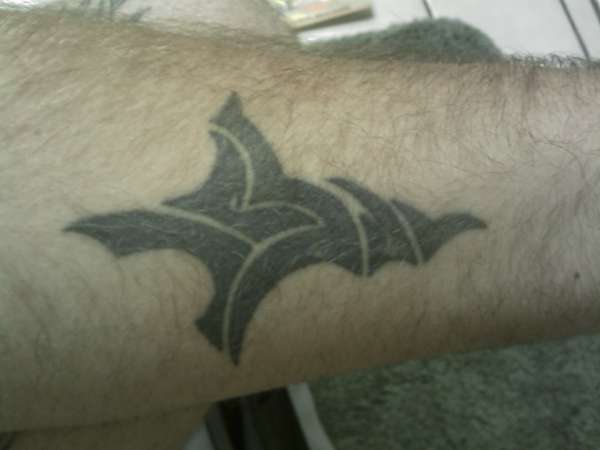 cross that says Jesus tattoo
