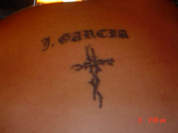 my name and a cross on my back tattoo