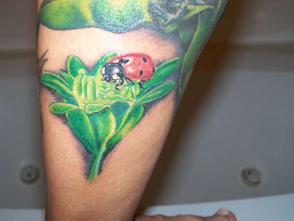 Flower Bud and Ladybug tattoo