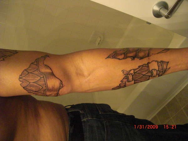 Arm greave over scale maille tattoo