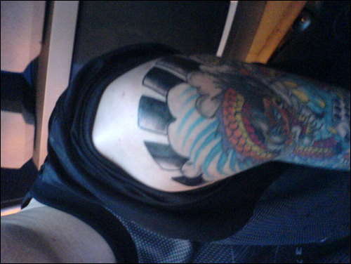 top of half arm sleeve tattoo