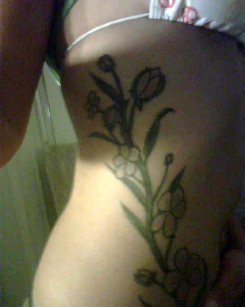 Jasmine on ribs tattoo