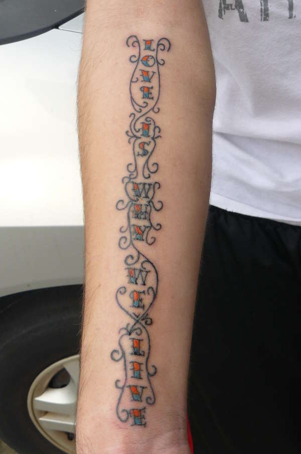 LOVE IS WHY WE LIVE tattoo