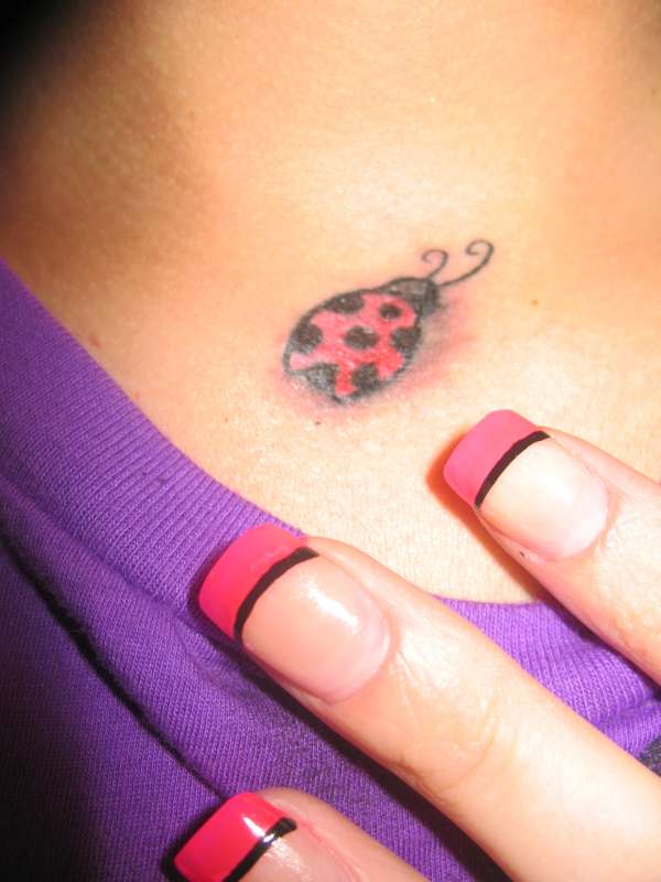 Ladybug throat tat tattoo