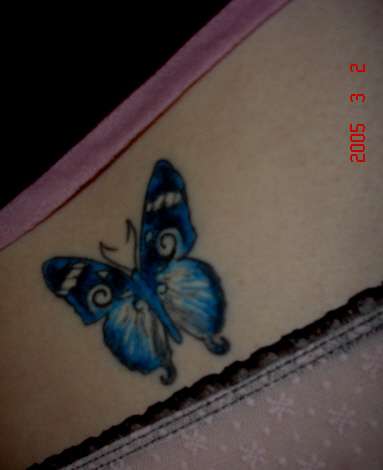 Mandy Lue's Bu})i({erfly tattoo