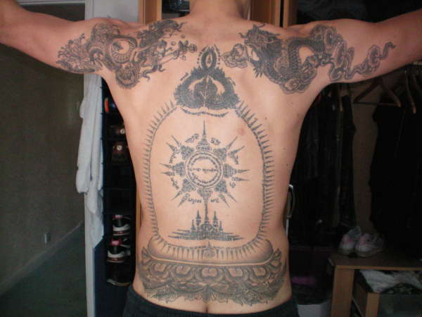 tibetan and ancient thai back work tattoo
