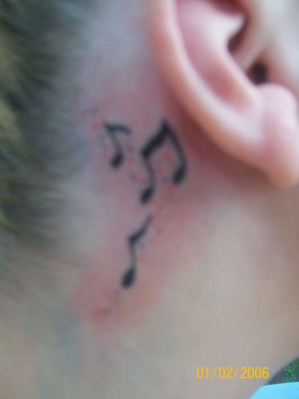 Behind Gina's Ear tattoo