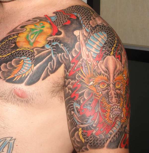 Japanese Traditional chest to half sleeve tattoo