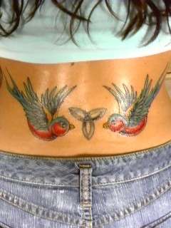 Pretty birds with celtic knot tattoo