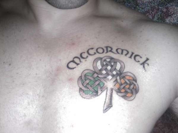 Shamrock with Ireland flag colors and last name. tattoo