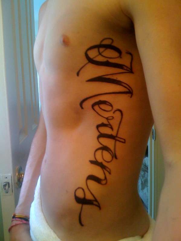 Rib Tat tattoo